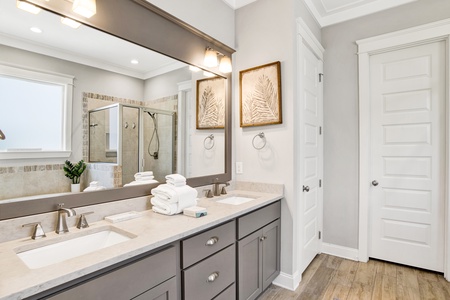 The private bathroom has dual vanities