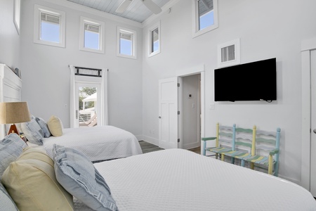 Bedroom 3 has balcony access, mounted TV and shares the hall bathroom