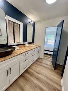 The shared bathroom is accessible from the master bedroom and hallway