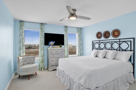 Guest Bedroom 1 has a King size bed, TV and shared bathroom
