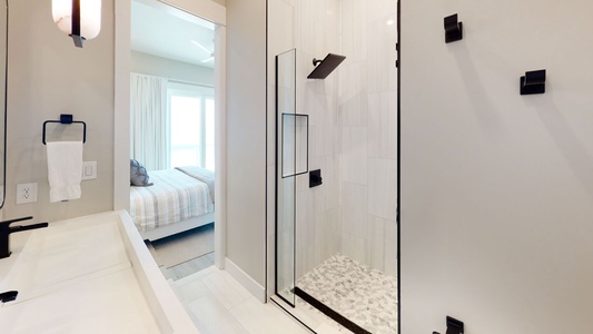 Bedroom 6 with a double vanity and walk-in shower