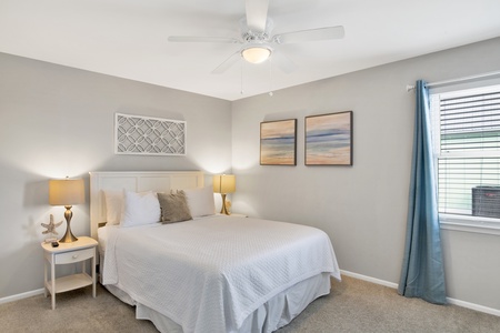 Master bedroom with a queen bed and ceiling fan