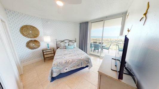 Bedroom 2 features a queen size bed, TV, balcony access, views and a private bathroom