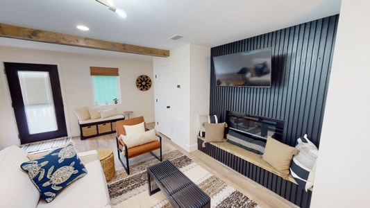 Comfortable seating, electric fireplace and a mounted television
