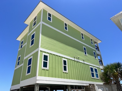 Above the Dunes is a 3-story home with 7 bedrooms/6 baths