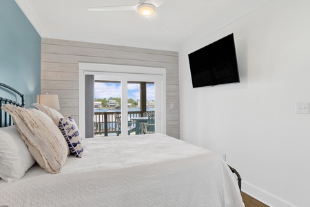 Bedroom 3 offers a private bathroom, balcony access, TV and King bed, sleeps 2
