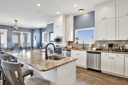 Fully equipped kitchen with stainless appliances and granite counter tops