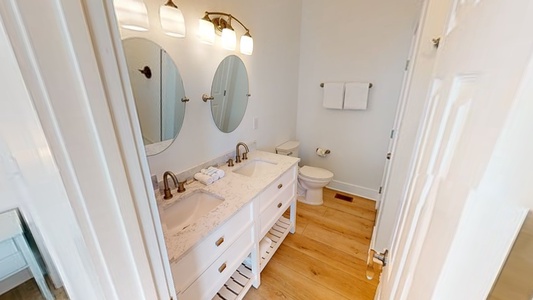 The private bath in Bedroom 3 has a double vanity