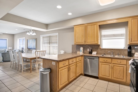 The kitchen has stainless appliances and granite counter tops