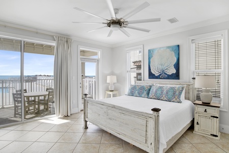 Dixie Tide-1st floor Bedroom 1 (Master) with a king bed, ceiling fan, TV, pool access, Gulf views and a private bathroom