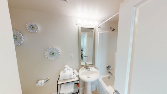 The private bathroom in Bedroom 2 has a tub shower combo