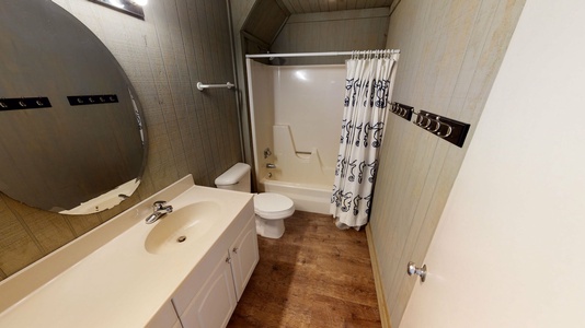 Downstairs bathroom features a tub/shower combo.