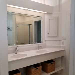 Double vanity in master bath with soaking tub and standing shower