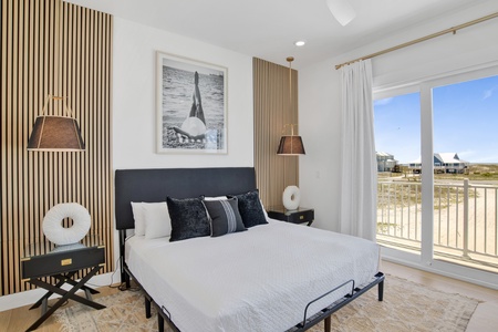 Bedroom 2 has a private bathroom, balcony access, TV and King bed, sleeps 2