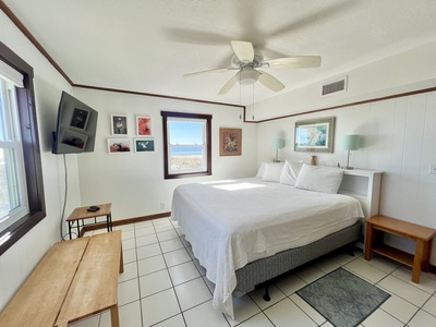 Master bedroom 1st floor with a king bed