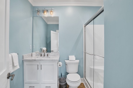 The private bathroom features a walk-in shower