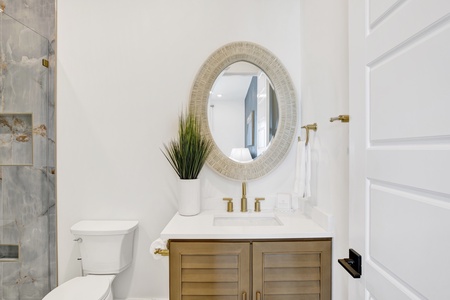 The private bathroom has a single vanity
