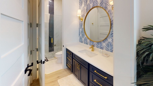 Bedroom #2 bathroom with a vanity and a large walk-in shower