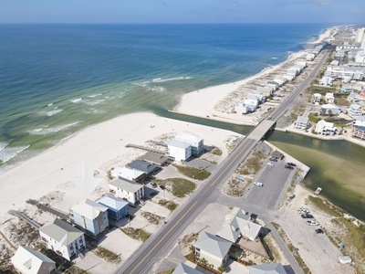 Birdseye view of West Beach Blvd, the Gulf and the Pass