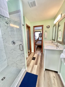 2nd floor Jack & Jill bathroom with a double vanity and walk-in shower