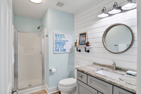 1st floor hall bathroom with a walk-in shower