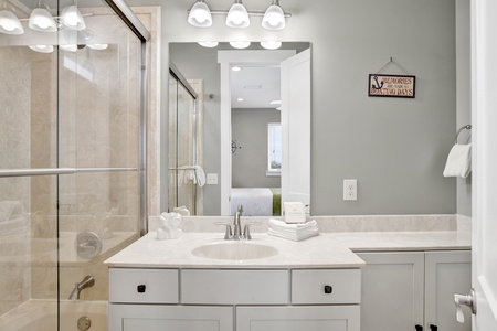 The private bathroom has a tub/shower combo