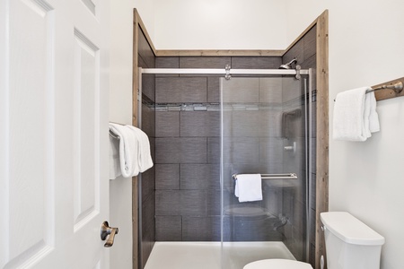 The master bathroom has a walk-in shower