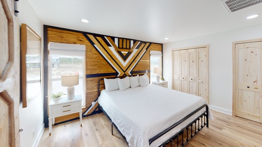 Master bedroom with a king size bed