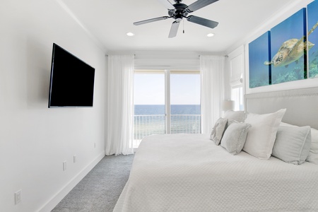 Bedroom 3 is on the 4th floor with a king bed, ceiling fan, Gulf views and a private balcony
