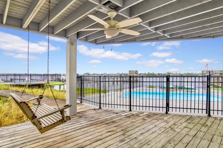 Balcony off of the downstairs studio with a swing