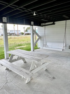 Swing and picnic table under the carport