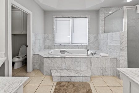 Enjoy a soak in the tub in the master suite