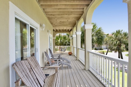 The balcony is covered, offering shade