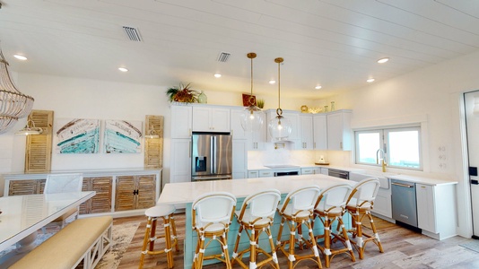 Open kitchen concept with marble countertops and bar seating for 6.