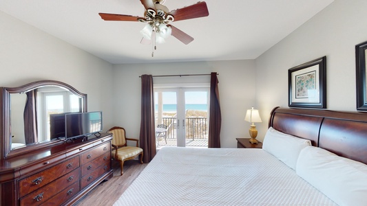 Bedroom 2 on the 1st floor features a private bathroom, TV, ceiling fan, Gulf views and balcony access
