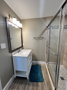 Private bathroom with tile shower