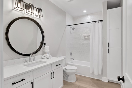 2nd floor shared bathroom in hallway with a tub/shower combo