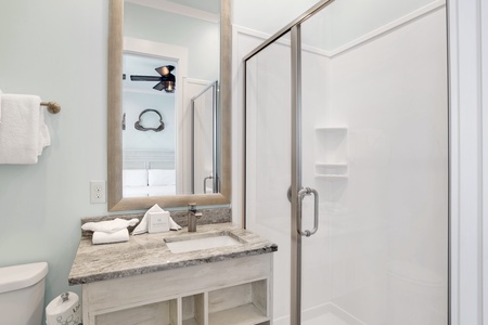 The private bathroom features a walk-in shower
