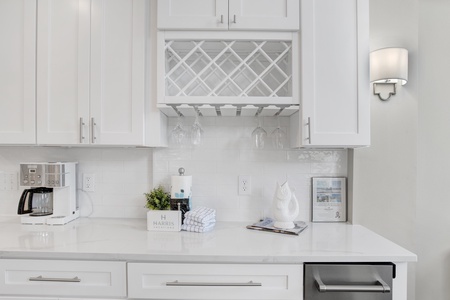Stone counters throughout, along with a standalone ice maker