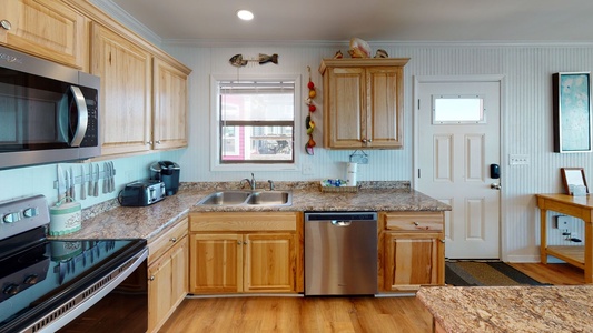 Updated kitchen with stainless appliances and granite countertops