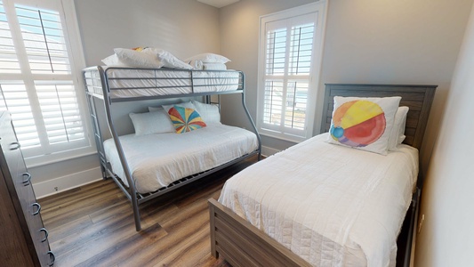 2nd floor Bedroom 3 sleeps 4 and has a TV and a private bathroom