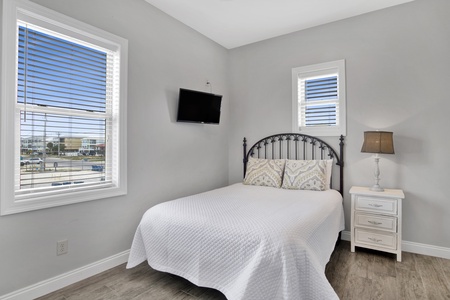 1st floor Bedroom 3 has a queen bed and a TV