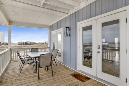 Outdoor dining on the covered balcony