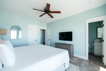 Bedroom 5 also comes with a ceiling fan and a television