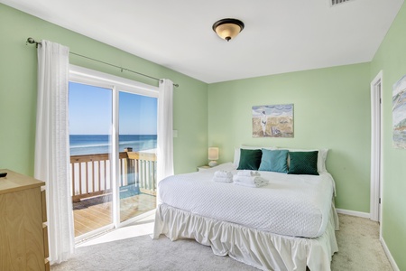 The master bedroom has a king bed, TV, Gulf views and deck access