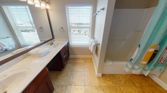 Private bath for Bedroom 7 with a double vanity and a tub/shower combo