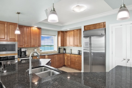 Stone counters and stainless appliances in the kitchen