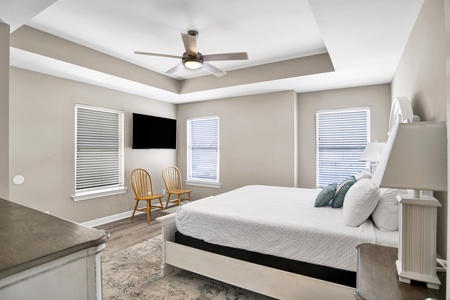 2nd floor guest bedroom has a TV and shares the hallway bathroom