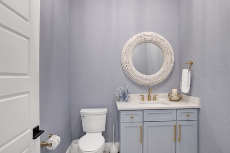 Half bathroom located off the living room
