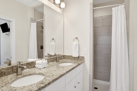 Private master bath with a double vanity and a walk-in shower